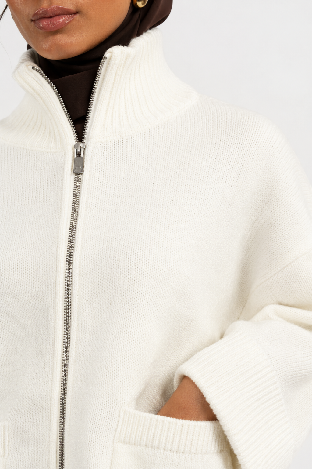 Pull zippé col montant